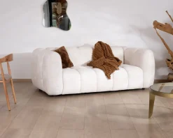 Canapé cocooning 3 places tissu bouclette blanc avec surpiqures