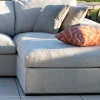 Canapé d'extérieur ultra confort en tissu beige chiné et coussins décos "Toliara" avec module ottoman
