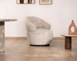 Chauffeuse effet boule avec surpiqures en tissu bouclette beige tramé 