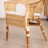 Elégant petit fauteuil en rotin tressé avec assise tissu "Noho"