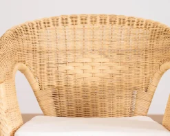 Elégant petit fauteuil en rotin tressé avec assise tissu "Noho"