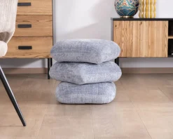 Pouf design pivotant en tissu tramé bleu glacier à reflets lumineux « Flow » esprit scandinave