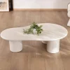 Table basse forme organique en micro-ciment teinté crème "Naura"