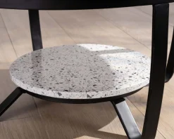 Table basse ronde en terrazzo blanc et métal noir 