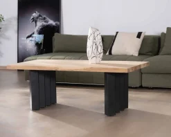 Table de salon design en acacia naturel et pieds métal plissés 